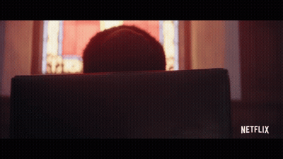 A Person Is Sitting In Front Of A Laptop With Netflix Written On The Bottom Right GIF