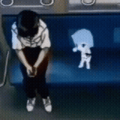 A Person Is Sitting On A Blue Couch With A Skeleton On The Back Of It . GIF
