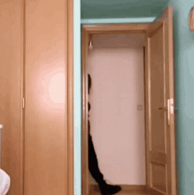 A Person Is Standing In A Doorway With Their Feet Visible GIF