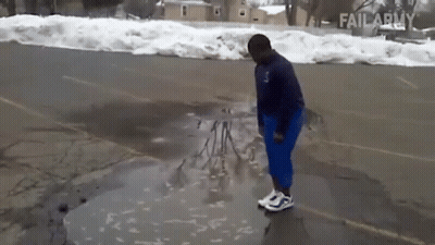 A Person Is Standing In A Puddle Of Water In A Parking Lot With Failarmy Written On The Bottom GIF