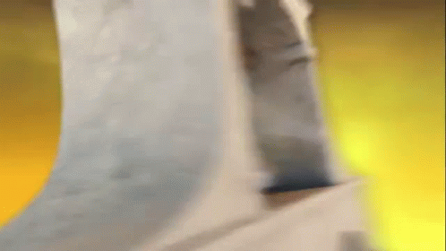 A Person Is Standing In A Room With A Yellow Background GIF