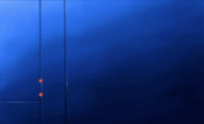 A Person Is Standing In Front Of A Blue Wall . GIF