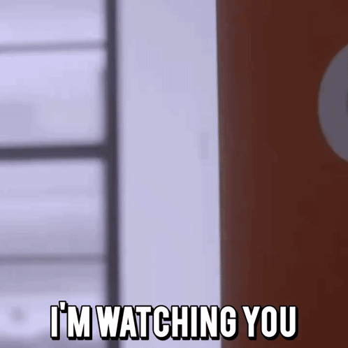 A Person Is Standing In Front Of A Door With The Words `` I 'M Watching You '' Written On It . GIF