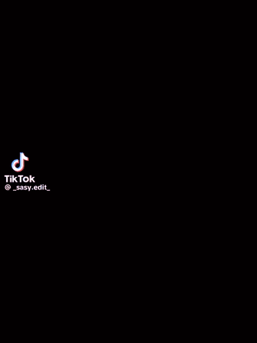 A Person Is Standing In Front Of A Full Moon In A Cartoon . GIF