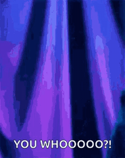 A Person Is Standing In Front Of A Purple Curtain With The Words `` You Whooooo '' Written On It . GIF