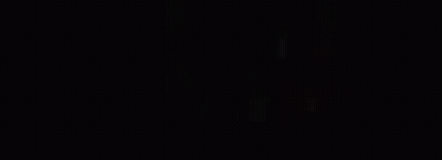 A Person Is Standing On A Bed In A Dark Room With Smoke Coming Out Of The Window . GIF