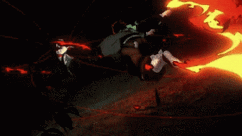 A Person Is Standing On A Rock With A Red Light Behind Them GIF