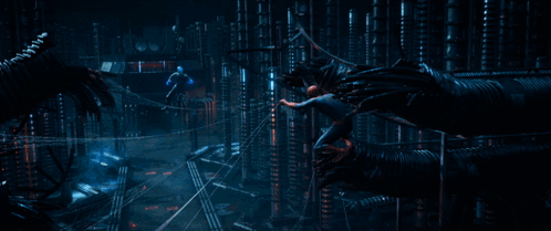 A Person Is Standing On A Wire With A Blue Light Coming From It GIF