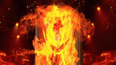 A Person Is Surrounded By Flames And The Word Rock Is Visible On The Screen GIF