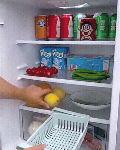A Person Is Taking A Basket Out Of A Refrigerator Filled With Food And Drinks . GIF