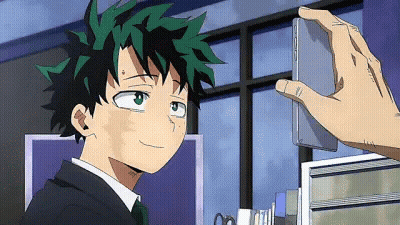 A Person Is Taking A Picture Of A Boy In A Suit And Tie With A Cell Phone . GIF