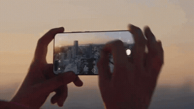 A Person Is Taking A Picture With A Cell Phone GIF