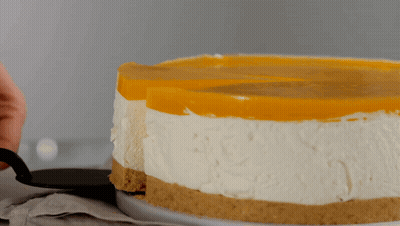 A Person Is Taking A Slice Of Cheesecake GIF