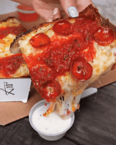 A Person Is Taking A Slice Of Pizza From A Box GIF