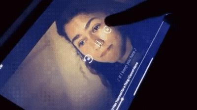 A Person Is Touching A Screen With A Picture Of A Woman And The Words " If I Keep You Here " On It GIF