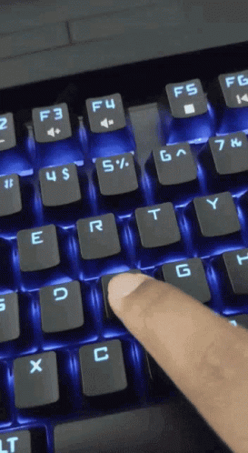 A Person Is Typing On A Keyboard With The F4 Key Highlighted In Blue GIF