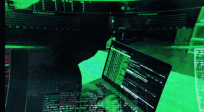 A Person Is Typing On A Laptop With A Green Screen Behind Them GIF