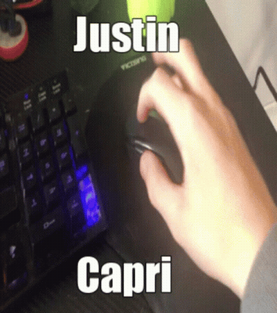 A Person Is Using A Computer Mouse With The Name Justin Capri On The Keyboard GIF
