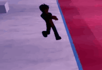A Person Is Walking Down A Red Carpet On A Ice Rink . GIF