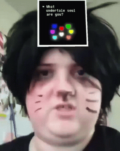 A Person Is Wearing A Cat Costume And Has A Picture On Their Head That Says What Undertale Soul Are You GIF