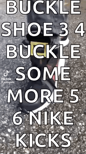 A Person Is Wearing A Pair Of Nike Shoes With A Buckle On The Side . GIF