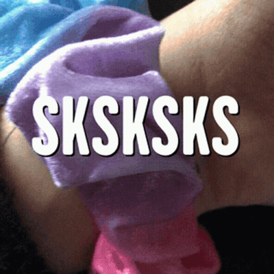 A Person Is Wearing A Scrunchie That Says Sksksks On It GIF