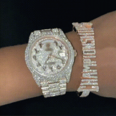 A Person Is Wearing A Watch And A Bracelet That Says Champions GIF