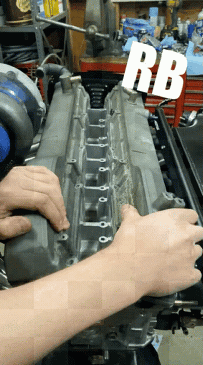 A Person Is Working On A Car Engine With The Letters Rb Visible GIF