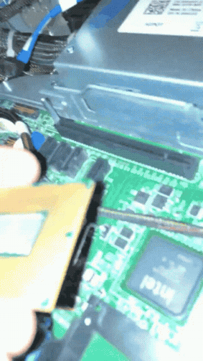 A Person Is Working On A Motherboard That Has An Intel Processor On It GIF