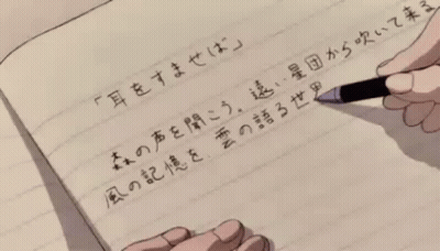 A Person Is Writing In A Notebook With Chinese Characters GIF