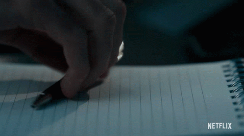 A Person Is Writing In A Notebook With Netflix Written On The Bottom Right GIF