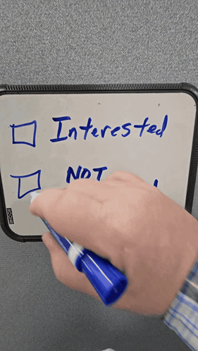A Person Is Writing Interested On A White Board GIF