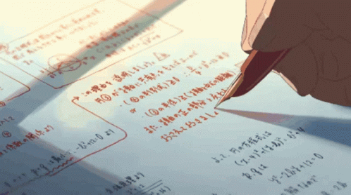 A Person Is Writing On A Piece Of Paper With Red Marker GIF