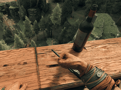 A Person Is Writing On A Piece Of Wood Next To A Bottle Of Wine That Says Chateau GIF