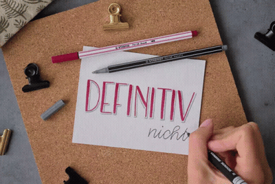 A Person Is Writing The Word Definitiv In Red On A Piece Of Paper GIF
