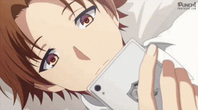 A Person Laying Down With A Phone In Their Hand And Punch.com Written On The Bottom GIF