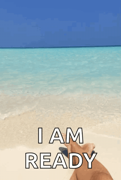 A Person Laying On A Beach With The Words " I Am Ready " GIF