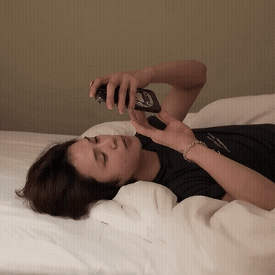 A Person Laying On A Bed With A Black Shirt That Says ' I Love You ' On It GIF