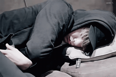 A Person Laying On A Couch With The Word Laundry On The Bottom Left GIF