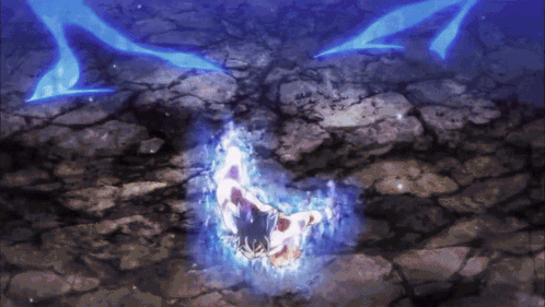 A Person Laying On A Rocky Surface With A Blue Light Behind Them GIF