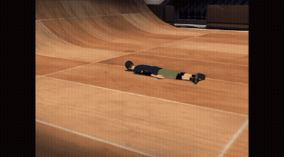 A Person Laying On Their Back On A Skateboard GIF