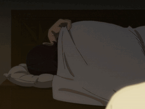 A Person Laying On Their Back With Their Head On A Pillow In The Dark GIF