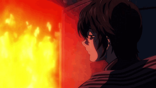 A Person Looking At A Fire With A Striped Shirt On GIF