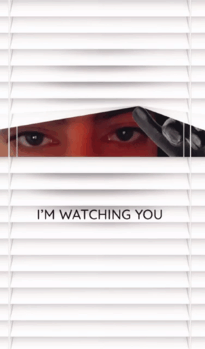 A Person Looking Through Blinds With The Words I 'M Watching You GIF