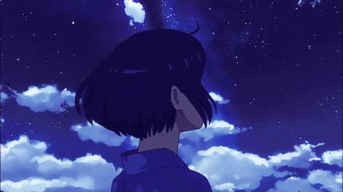 A Person Looking Up At A Blue Sky With Clouds And Stars GIF
