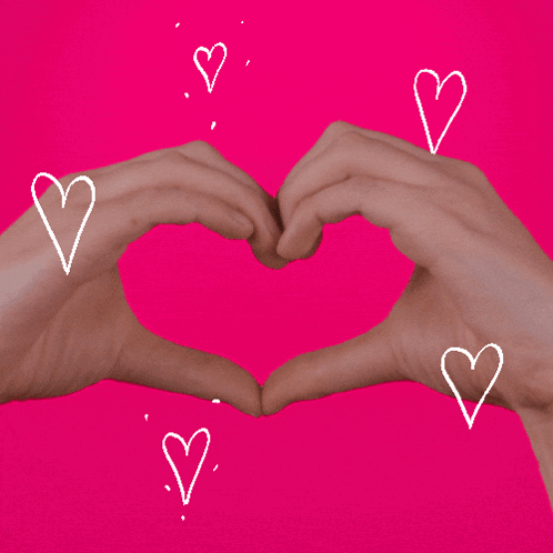 A Person Making A Heart Shape With Their Hands Surrounded By Hearts GIF