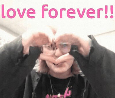 A Person Making A Heart Shape With Their Hands With The Words Love Forever Written Above Them GIF