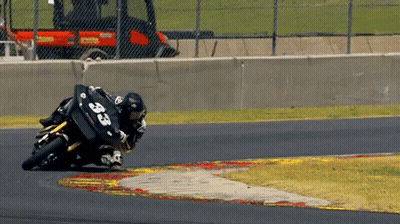 A Person On A Motorcycle With The Number 33 On Their Back GIF