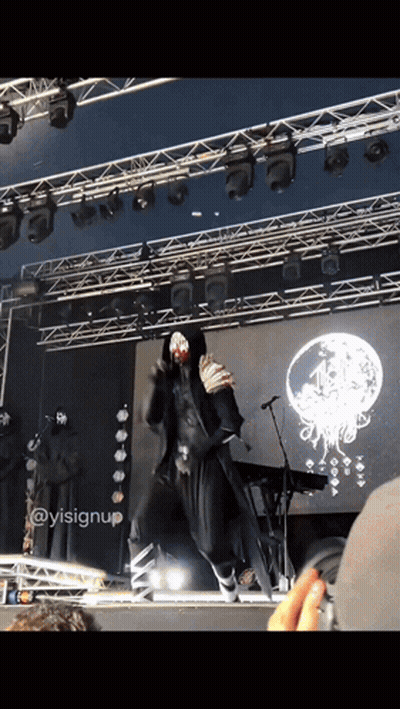 A Person On A Stage With A Sign That Says ' Ysisignup ' GIF