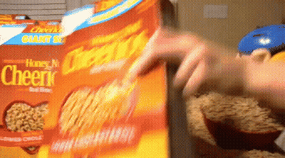 A Person Opens A Box Of Honey Nut Cheerios Cereal GIF